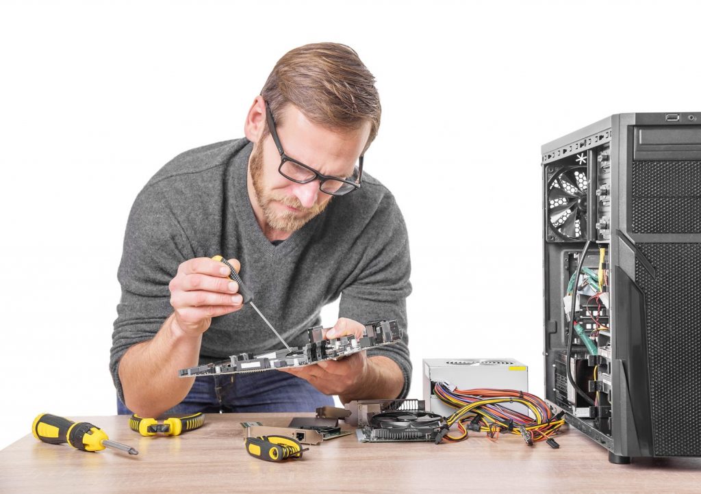 Technician performing computer repair