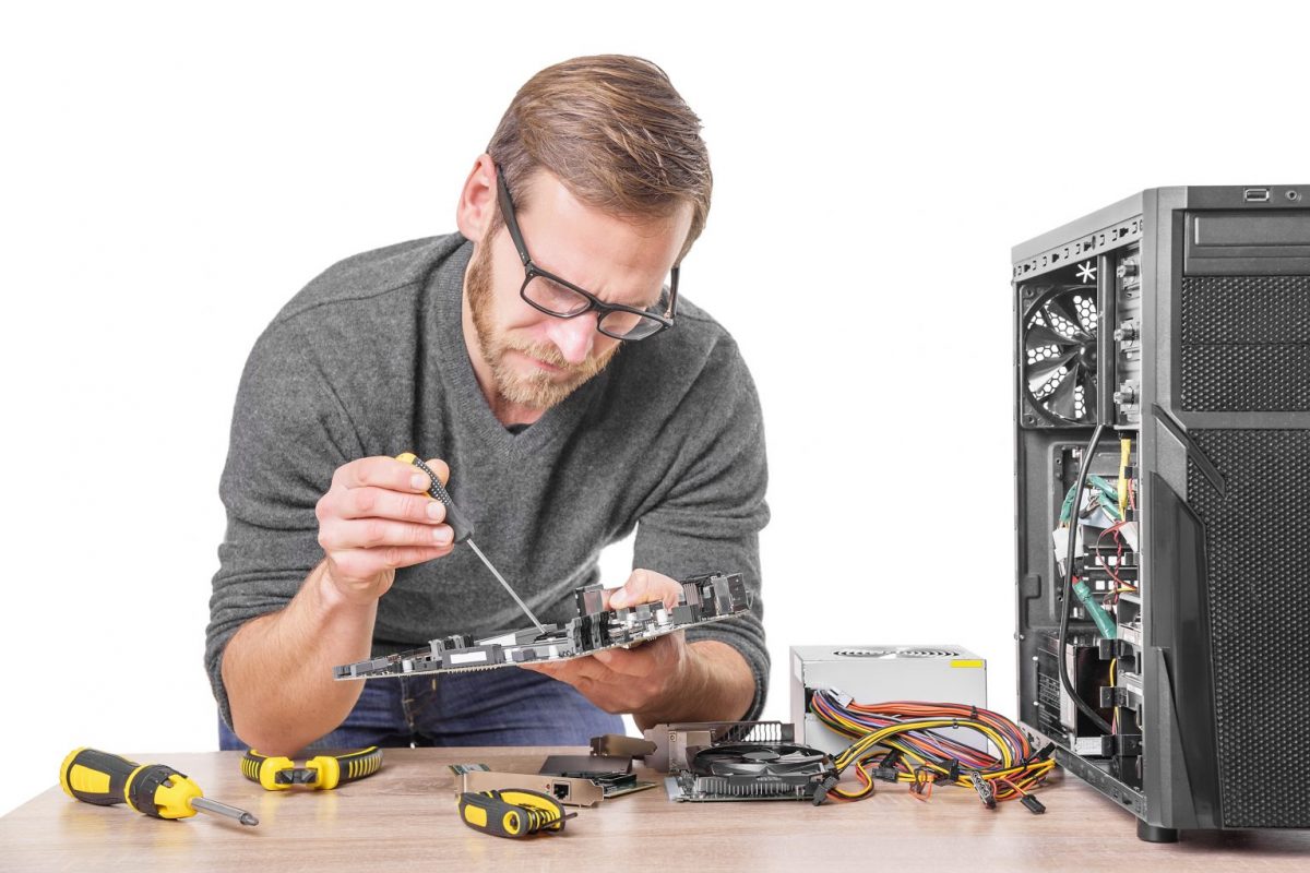 Technician performing computer repair