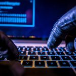 gloved hands trying to break Toronto cybersecurity